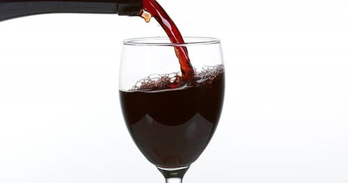 Pouring Red Wine into Glass in Close Up
