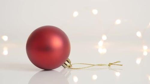 Slow tilt on Christmas tree round decoration slow tilt 4K 2160p 30fps UltraHD footage - Golden stri