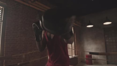 Man Boxing in Boxing Ring During Training