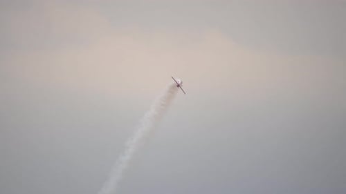 Airplane Aerobatics Show in the Sky with Smoke