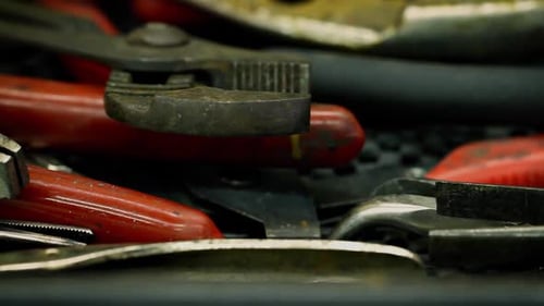 Camera dollies across old and grimy tools