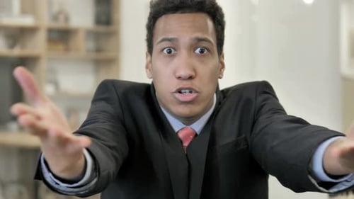 Young Adult in Suit Gesturing in Anger