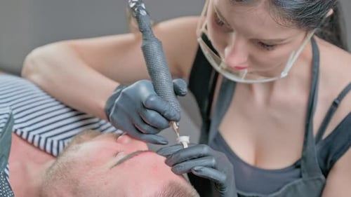 Master Beautician Does Eyebrow Tattoo