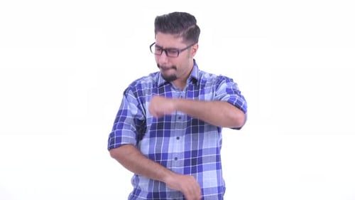Young Man Gesturing Against a White Background