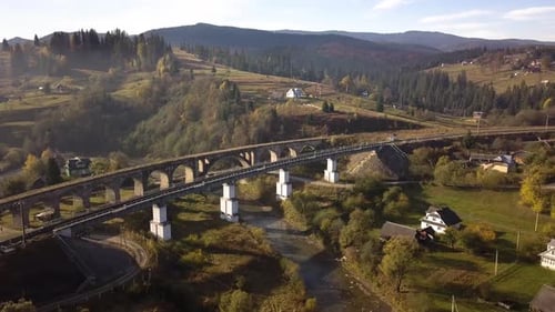 Aerial view of an old ruined train bridge in town of Vorokhta in Carpathian mountains, Ukraine.