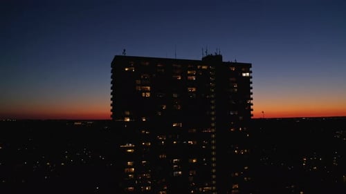 Orange and Blue-Toned Sky During Sunset, Tall Building's Silhouette in Denmark