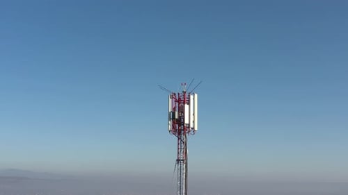 Flight nearby telecommunication tower construction 4K drone footage
