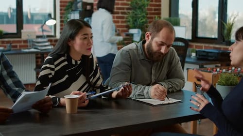 Diverse Team Having a Meeting in a Modern Office