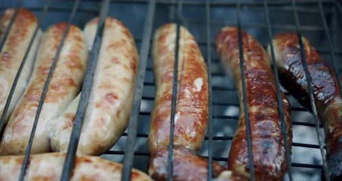 Sausages Are Fried on an Open Fire, Close Up Slow Motion V2