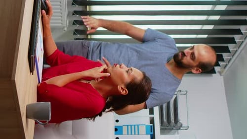 Vertical Video: Business People Discussing New Strategy