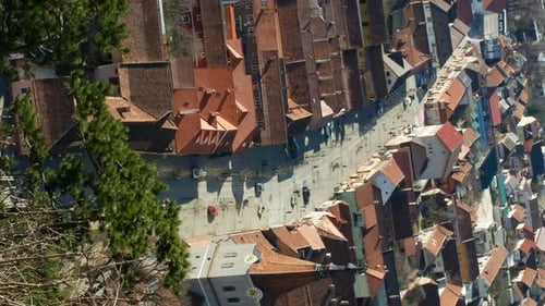 Vertical An aerial view of an old European city from the forest.