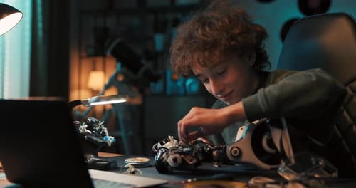 Boy Works to Create Remotecontrolled Robot Uses Soldering Iron Tools Robotics Enthusiast Develops