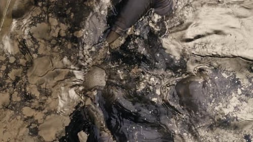 Bronze Head Submerged in Murky Abstract Liquid