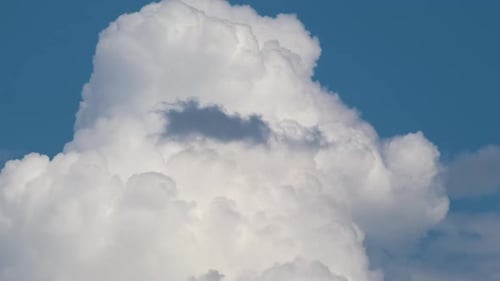 Time Lapse Footage of Fast Moving White Puffy Cumulus Clouds on Blue Clear Sky