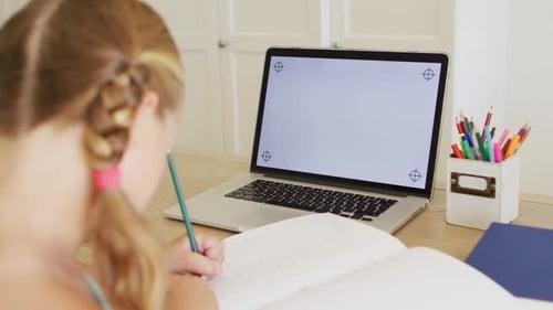 Child Studies at Computer in Home Setting