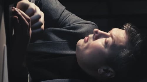 Young Adult Resting Indoors at Night