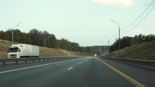Car Rides On a Highway Road That Runs Through The Fields And Forests POV Concept