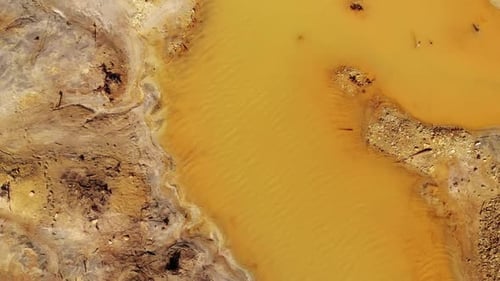 Orange Soil is Contaminated with Heavy Metals From an Industrial Plant