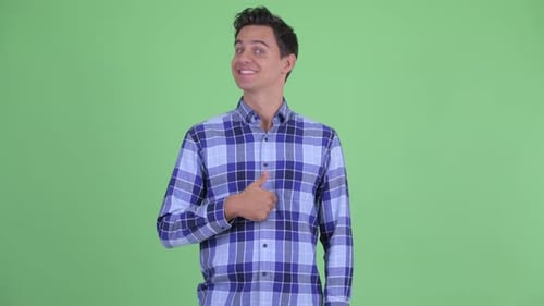 Cheerful Man Gives Thumbs Up on Green Screen