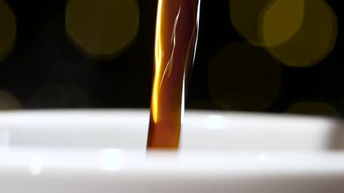 Hot Brown Coffee Pouring Into White Cup