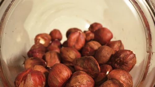 Jar of Brown Shelled Hazelnuts Close Up