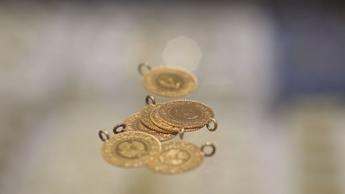 Close Up of Stacked Gold Coins with Loops