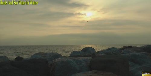 Rocks And Sea Water In Winter