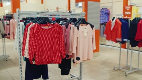 Stands With Clothes In a Clothing Store