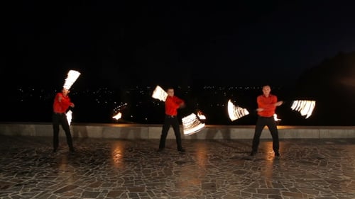Talented Fire Dancers Perform in the Dark
