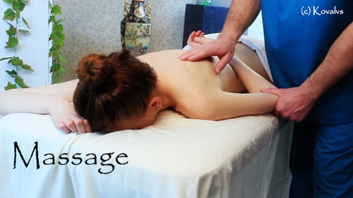 Massage Therapist Massaging Woman Lying Down