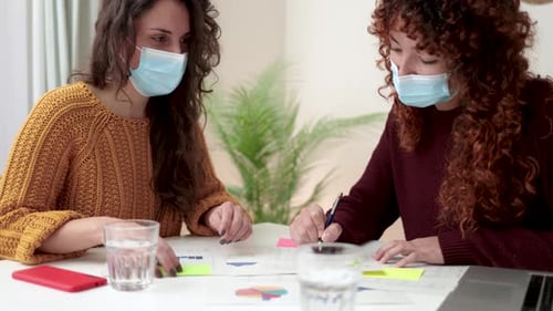 Young Business People Working Inside Coworking Office Wearing Protective Masks During Coronavirus