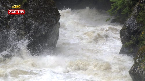 Roaring River Flowing Through Rocky Wilderness