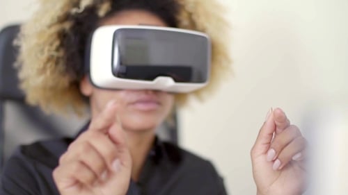 Businesswoman Working In Virtual Reality In Office