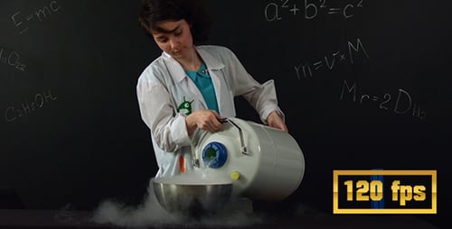 The Girl Pours Liquid Nitrogen in an Iron Bowl
