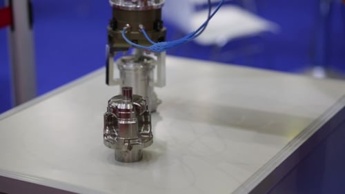 Robotic Arm Moving Metal Pieces