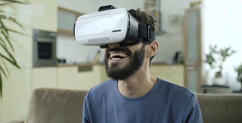 Man Enjoys Virtual Reality Headset Experience at Home