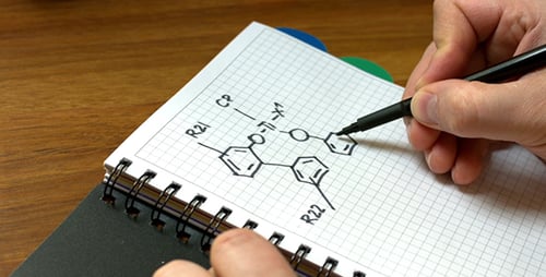 Hand Drawing Complex Chemical Formula on Grid Paper