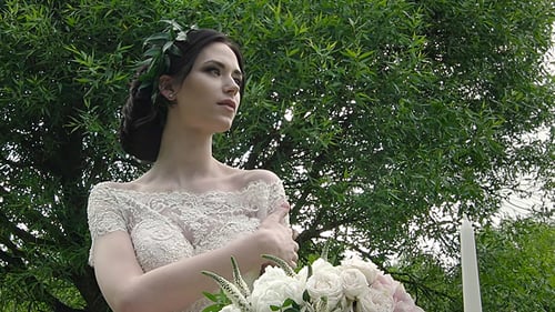Beautiful Bride in White Dress Posing Outdoors