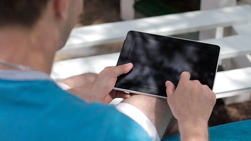 Man Using Tablet Device Outdoors