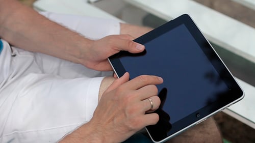 Man Using Tablet Device Outside