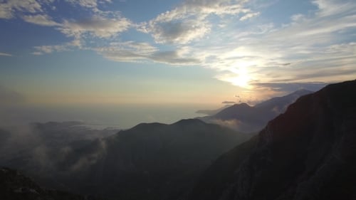 Majestic Mountains and Coastline Aerial at Sunrise