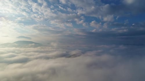 Aerial View of Scenic Mountains in the Clouds