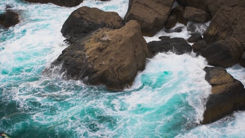 The Waves of the Sea Rolled on Coastal Rocks.