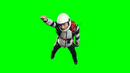 Man in Skydiving Suit Freefalling on Green Screen
