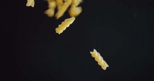 Macaroni Are Falling on the Glass, Close Up, Food and Ingredients,