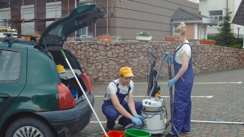The Workers Connect a Vacuum Cleaner.