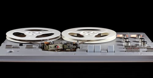 Vintage Reel-to-Reel Tape Recorder in Operation