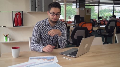 Young Professional Worker At The Office.