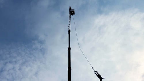 Bungee Jumper Jumping from Tall Crane