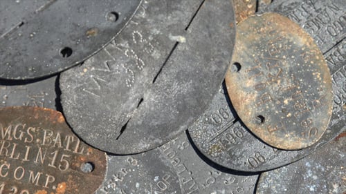 Weathered Military Dog Tags Showing History and Conflict